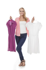 beautiful casual girl choosing between two dresses