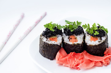 Rolls with salmon, caviar and pickled ginger