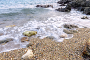 Long exposure shot. Sea scape with stone beach at Thailand