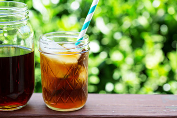 Iced coffee in mason jars outdoors