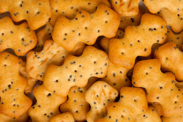 Top view dry cracker crackers with poppy seeds isolated on white