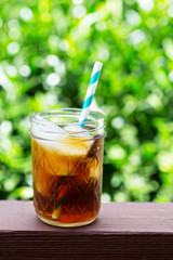Iced coffee in mason jars outdoors