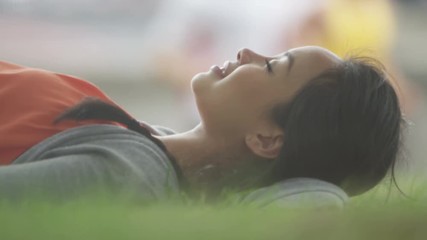  Happy pregnant woman relaxing in the park with hands on her belly - Powered by Adobe