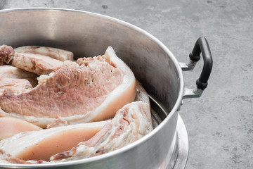 boil pork in steam pot, selective focus
