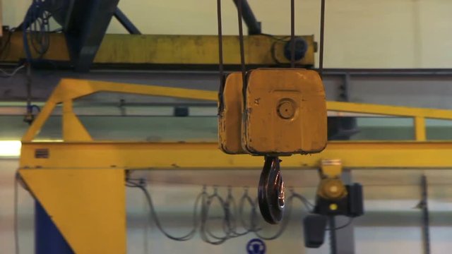 The movement of the hook of the gantry crane at the plant.