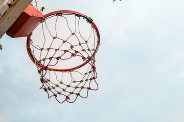 a basketball hoop with a nice sky.
