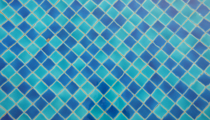 swimming pool floor on my vacation. feel so relax here. a nice navy blue tile. Background texture pattern.