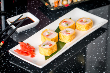 Sushi roll with scallop and Tomago 