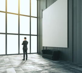Fototapeta premium Thinking businessman in room