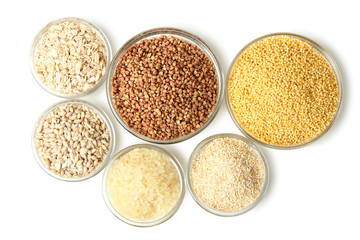 a variety of cereals in bowl on white background isolated