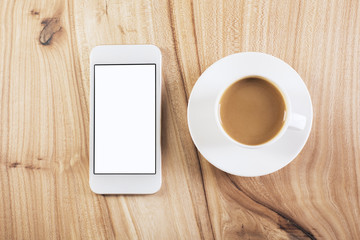 Coffee and cellphone on table