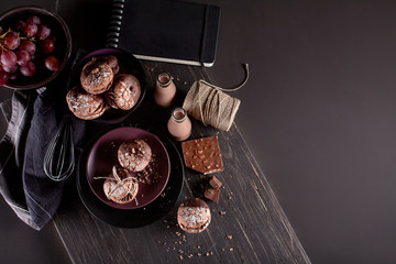 Organic almond cookies, grapes on dark wooden background with ch