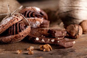 Christmas almond cookies with pieces of chocolate and walnuts on