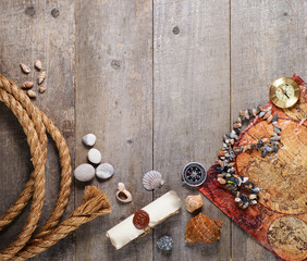 Travel items on wooden table. Summer time sea vacation background. Top view with copy space