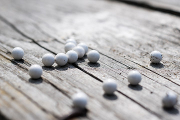 airsoft balls on a wooden table