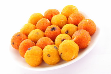 Red and yellow  Diwali sweets  Ladoo or bundi laddu in leaf.