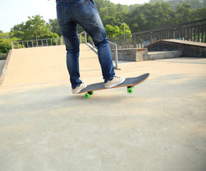 Fototapeta na wymiar skateboarder skateboarding at skatepark