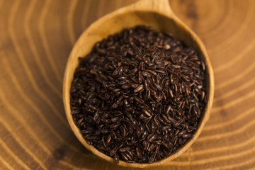 Psyllium seeds on wooden spoon