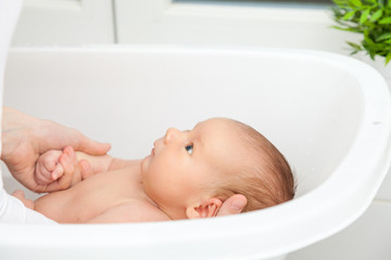 Bathtime for a cute little newborn