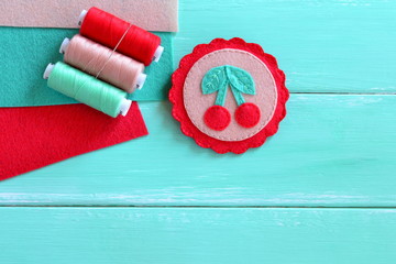 Felt brooch hand embroidered summer. Felt cherry ornament. Set of multicolored threads. Set of...