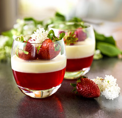 Spring dessert pannacotta with strawberries and flowers