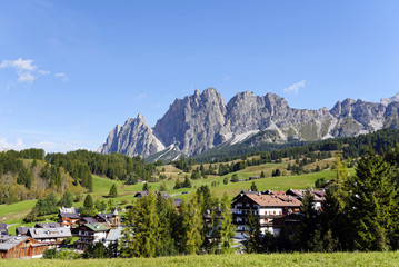 Fototapeta na wymiar Alpine resort in the Dolomites near Cortina d'Ampezzo. The Pomagagnon mountain in the background. SouthTyrol, Italy, Europe, sept. 2015