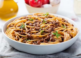 Spaghetti bolognese with cheese and basil 