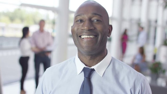  Portrait of confident smiling businessman in modern office building