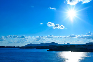 sunbeam over an island with copy space and view over the sea. 