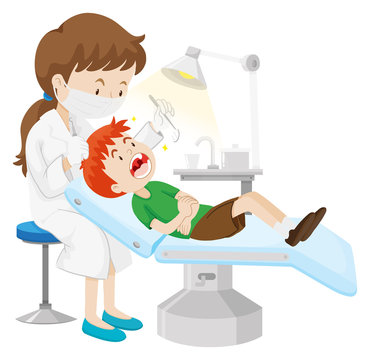 Boy having teeth checked by dentist