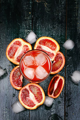 Fresh juice from blood oranges ice wooden retro cool summer drink