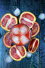Fresh juice from blood oranges ice wooden retro cool summer drink