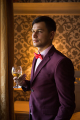 the groom on the morning of the wedding in the house