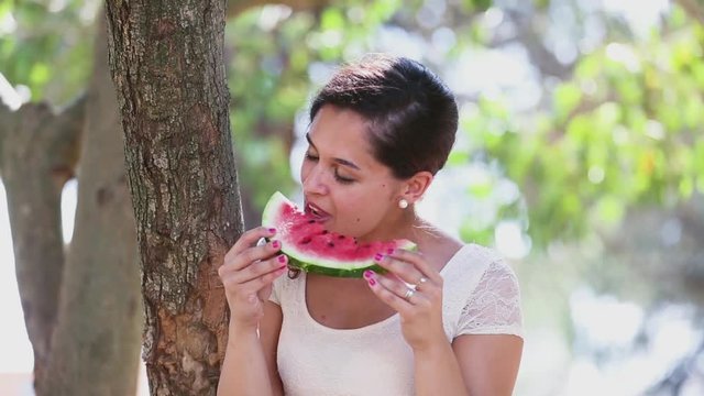 Woman eating watermelon