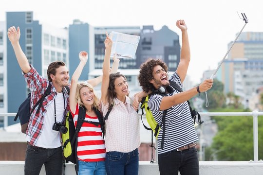 Group Of Friends Taking Selfie With Selfie Stick