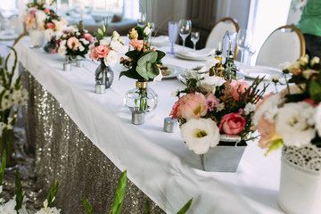 Small bouquets of flowers in the vase with water