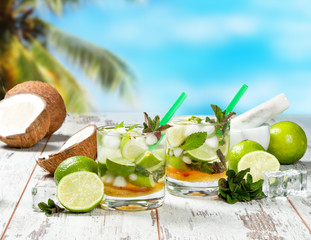 Mojito lime drinks on wooden background