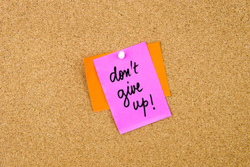 Do Not Give Up written on paper note