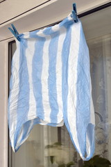 Blue plastic bag to dry on rope for reuse