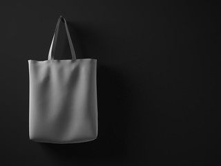 Photo gray color rubberized material bag hanging in left side. Empty concrete painted black wall background.Highly detailed texture, space for your business message.Horizontal mockup.3D rendering