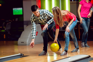 Cheerful friends at the bowling alley