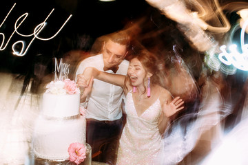 Wedding lights and happy just married couple