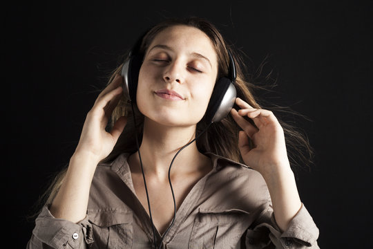 Young woman listening music