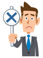 ビジネスマンが不正解の札を出す
