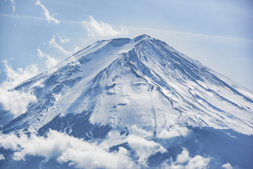 Fototapeta na wymiar Close up to the top fuji mountain in winter with clear blue sky and white cloud, Japan 