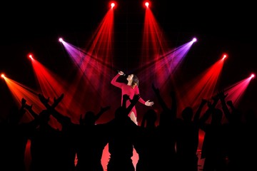 Fototapeta na wymiar Composite image of people enjoying a concert