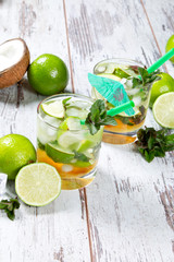Mojito lime drinks on wooden background