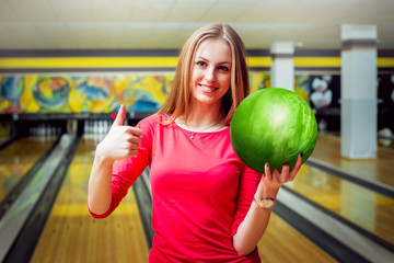 Beautiful girl at the bowling alley