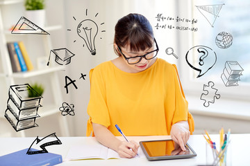 asian woman student with tablet pc at home