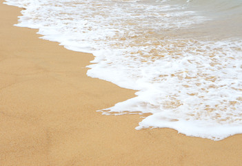 Sea wave and sandy beach
